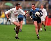 11 April 1999; Ray Cosgrove of Dublin in action against Dermot Earley of Kildare during the Church and General National Football League Quarter-Final match between Dublin and Kildare at Croke Park in Dublin. Photo by Damien Eagers/Sportsfile