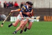 28 March 1999; Thomas Dunne of Tipperary in action against Brian McEvoy of Kilkenny during the Church and General National Hurling League Division 1B match between Kilkenny and Tipperary at Nowlan Park in Kilkenny. Photo by Matt Browne/Sportsfile