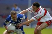 6 August 2005; Ross Munnelly, Laois, in action against Kevin McGuckin, Derry. Bank of Ireland All-Ireland Senior Football Championship Qualifier, Round 4, Laois v Derry, Croke Park, Dublin. Picture credit; Brendan Moran / SPORTSFILE