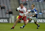 6 August 2005; Paul Murphy, Derry, in action against Joe Higgins, Laois. Bank of Ireland All-Ireland Senior Football Championship Qualifier, Round 4, Laois v Derry, Croke Park, Dublin. Picture credit; Brendan Moran / SPORTSFILE