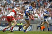 6 August 2005; Noel Garvan, Laois, in action against Paddy Bradley, Derry. Bank of Ireland All-Ireland Senior Football Championship Qualifier, Round 4, Laois v Derry, Croke Park, Dublin. Picture credit; Damien Eagers / SPORTSFILE