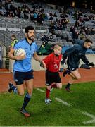 1 March 2014; Mascot Scott Craine, Trinity Gaels GAA Club, with Dublin's Cian O'Sullivan before the game. Allianz Football League, Division 1, Round 3, Dublin v Cork, Croke Park, Dublin. Picture credit: Ray McManus / SPORTSFILE