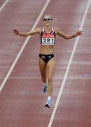 14 August 2005; Paula Radcliffe, Great Britain, celebrates as she crosses the finish line for victory in the Women's Marathon. 2005 IAAF World Athletic Championships, Helsinki, Finland. Picture credit; Pat Murphy / SPORTSFILE