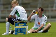 16 August 2005; Damien Duff, Republic of Ireland, takes a break with team-mate Andy O'Brien during squad training. Lansdowne Road, Dublin. Picture credit; David Maher / SPORTSFILE