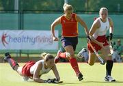 20 August 2005; Crista Cullen, England, supported by team-mate Kate Walsh, right, gets in a clearance ahead of Raquel Huertas, Spain. 7th Women's European Nations Hockey Championship, 3rd / 4th Place Play-Off Game, England v Spain, Belfield, UCD, Dublin. Picture credit; Brendan Moran / SPORTSFILE