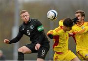 6 March 2014; Sam Byrne, Republic of Ireland, scores his side's first goal despite the efforts of Cosmin Achim, left, and George Puscas, Romania. U19 International Friendly, Republic of Ireland v Romania, O’Shea Park, Blarney, Co. Cork. Picture credit: Diarmuid Greene / SPORTSFILE