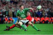 3 February 2002; Ireland's Brian O'Driscoll releases the ball despite being tackled by Kevin Morgan, Wales. Ireland v Wales, Six Nations Championships, Landsdowne Road, Dublin. Rugby. Picture credit; Matt Browne / SPORTSFILE