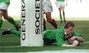 19 March 2000; Brian O'Driscoll, Ireland, goes over to score the first of his three tries. Six Nations Rugby International, France v Ireland, Stade de France, Paris, France. Picture credit: Ray Lohan / SPORTSFILE