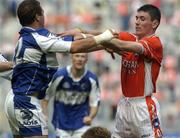 20 August 2005; Chris Conway, Laois, and  Andy Mallon, Armagh, tussle during the match. Bank of Ireland All-Ireland Senior Football Championship Quarter-Final, Armagh v Laois, Croke Park, Dublin. Picture credit; Damien Eagers / SPORTSFILE