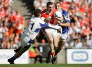 20 August 2005; Armagh's Oisin Mc Conville in action against Fergal Byron, Laois goalkeeper. Bank of Ireland All-Ireland Senior Football Championship Quarter-Final, Armagh v Laois, Croke Park, Dublin. Picture credit; Oliver Mc Veigh / SPORTSFILE