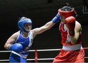 8 March 2014; Moira McElligot, blue, exchanges punches with Kelly Harrington, red, during their 64 Kg bout. National Senior Women's Boxing Championship Finals, National Stadium, Dublin. Picture credit: Matt Browne / SPORTSFILE