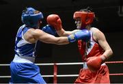 8 March 2014; Kelly Harrington, red, exchanges punches with Moira McElligot, blue, during their 64 Kg bout. National Senior Women's Boxing Championship Finals, National Stadium, Dublin. Picture credit: Matt Browne / SPORTSFILE
