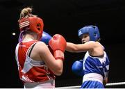 8 March 2014; Ciara Ginty, blue, exchanges punches with Katelyn Phelan, red, during their 60 Kg bout. National Senior Women's Boxing Championship Finals, National Stadium, Dublin. Picture credit: Matt Browne / SPORTSFILE