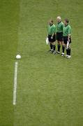 27 August 2005; Referee Gerry Kinneavy, centre, stands with his linesmen John Geaney, left, and Aidan Mangan, right, for the National Anthem. Bank of Ireland All-Ireland Senior Football Championship Quarter-Final Replay, Dublin v Tyrone, Croke Park, Dublin. Picture credit; Ray McManus / SPORTSFILE