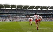 27 August 2005; Tyrone players run onto the pitch. Bank of Ireland All-Ireland Senior Football Championship Quarter-Final Replay, Dublin v Tyrone, Croke Park, Dublin. Picture credit; Damien Eagers / SPORTSFILE