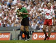 27 August 2005; Tyrone's Owen Mulligan passes a stray dog to referee Gerry Kinneavy. Bank of Ireland All-Ireland Senior Football Championship Quarter-Final Replay, Dublin v Tyrone, Croke Park, Dublin. Picture credit; Damien Eagers / SPORTSFILE