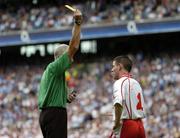27 August 2005; Referee Gerry Kinneavy issues a yellow card to Tyrone's Michael McGee. Bank of Ireland All-Ireland Senior Football Championship Quarter-Final Replay, Dublin v Tyrone, Croke Park, Dublin. Picture credit; Damien Eagers / SPORTSFILE