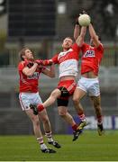 9 March 2014; Patsy Bradley, Derry, in action against Andrew O'Sullivan left, and Kevin O'Driscoll, Cork. Allianz Football League, Division 1, Round 4, Cork v Derry, Pairc Ui Rinn, Cork. Picture credit: Diarmuid Greene / SPORTSFILE