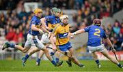 9 March 2014; Conor McGrath, Clare, tries to evade Tipperary's Paddy Stapleton, while Shane McGrath, left, and Cathal Barrett try to keep up. Allianz Hurling League, Division 1A, Round 3, Tipperary v Clare, Semple Stadium, Thurles, Co. Tipperary. Picture credit: Brendan Moran / SPORTSFILE