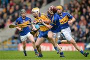 9 March 2014; Conor McGrath, Clare, in action against Paddy Stapleton and Shane McGrath, right, Tipperary. Allianz Hurling League, Division 1A, Round 3, Tipperary v Clare, Semple Stadium, Thurles, Co. Tipperary. Picture credit: Brendan Moran / SPORTSFILE