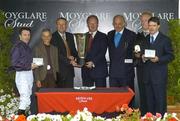 4 September 2005; The winning connections of Rumplestiltskin including from left jockey Kieran Fallon, extreme left, Niarchos Family representatives, Alan Cooper, Moyglare Stud, centre, part owner John Magnier, third from right, Damien O'Halloran, groom, second from right, and trainer Aidan O'Brien, extreme right, Moyglare Stud Stakes. Curragh Racecourse, Co. Kildare. Picture credit; Pat Murphy / SPORTSFILE