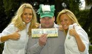 7 September 2005; Ireland fan Kevin Moore, Dungarvan, Co. Waterford, with models Joanne Dever, left, and Jenny O'Dwyer, was celebrating after winning tickets to the big match from www.carlsbergmoments.ie, a website created by Carlsberg for fans to vote for their favourite World Cup moment - Kevin voted for Kevin Sheedy's goal against England in Italia '90. Ray Houghton's goal against Italy in USA '94 is currently leading the poll. Berkeley Court Hotel, Dublin. Picture credit; Brendan Moran / SPORTSFILE