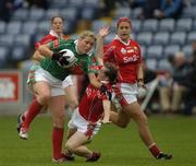 10 September 2005; Kelly Colleran, Mayo, in action against Briege Corkery and Brid Stack, right, Cork. TG4 Ladies Senior Football All-Ireland Championship Semi-Final, Cork v Mayo, O'Moore Park, Portlaoise, Co. Laois. Picture credit; Damien Eagers / SPORTSFILE