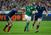 15 March 2014; Andrew Trimble, Ireland, is tackled by Maxime Médard, France. RBS Six Nations Rugby Championship 2014, France v Ireland, Stade De France, Saint Denis, Paris, France. Picture credit: Stephen McCarthy / SPORTSFILE