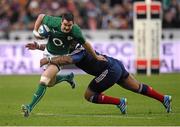 15 March 2014; Jonathan Sexton, Ireland, is tackled by Mathieu Bastareaud, France. RBS Six Nations Rugby Championship 2014, France v Ireland, Stade De France, Saint Denis, Paris, France. Picture credit: Stephen McCarthy / SPORTSFILE