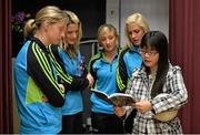 17 March 2014; TG4 Allstar footballers Cora Staunton, Mayo, Juliet Murphy, Cork, Sinead Burke, Galway and Brid Stack, Cork, with English teacher Daisy Leung on a visit to Pooi To Middle School, Kowloon City. 2014 TG4 Ladies Football All-Star Tour, Hong Kong, China. Picture credit: Brendan Moran / SPORTSFILE