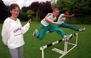 11 May 1999; Catherina McKiernan, left, pictured alongside Paul Howard, aged 16, from Cabinteely, Dublin, and Shireen McDonagh from Balinteer, Dublin, aged 14, at the launch of the Capri-Sun BLOE Athletic Championships at Merrion Square in Dublin. Photo By Brendan Moran/Sportsfile