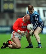25 April 1999; Gerard Reid of Armagh in action against Dessie Farrell of Dublin during the Church & General National Football League Division 1 Semi-Final match between Armagh and Dublin at Croke Park in Dublin. Photo by Ray McManus/Sportsfile