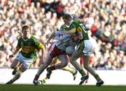 25 September 2005; Chris Lawn, Tyrone, is tackled by Colm Cooper, Kerry. Bank of Ireland All-Ireland Senior Football Championship Final, Kerry v Tyrone, Croke Park, Dublin. Picture credit; Brendan Moran / SPORTSFILE *** Local Caption *** Any photograph taken by SPORTSFILE during, or in connection with, the 2005 Bank of Ireland All-Ireland Senior Football Final which displays GAA logos or contains an image or part of an image of any GAA intellectual property, or, which contains images of a GAA player/players in their playing uniforms, may only be used for editorial and non-advertising purposes.  Use of photographs for advertising, as posters or for purchase separately is strictly prohibited unless prior written approval has been obtained from the Gaelic Athletic Association.