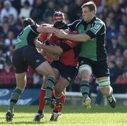 1 October 2005; Denis Leamy, Munster, is tackled by David Slemen,left, and Colm Rigney, Connacht. Celtic League 2005-2006, Group A, Connacht v Munster, Sportsground, Galway. Picture credit: Matt Browne / SPORTSFILE