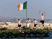 7 October 2005; Republic of Ireland supporters, left to right, John Igoe, Alan Igoe, Daryl Levy and Richie Hadlett, all from Kildare, jump into the sea for a swim ahead of the 2006 FIFA World Cup Qualifier against Cyprus. Limassol, Cyprus. Picture credit: David Maher / SPORTSFILE