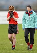 21 March 2014; A dejected Louise Ni Mhuircheartaigh, University College Cork, leaves the field after the game with Selector Grace Kearney. O'Connor Cup, Semi-Final, University of Limerick v University College Cork. Queen's University, Belfast, Co. Antrim. Picture credit: Oliver McVeigh / SPORTSFILE