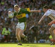 25 September 2005; Colm Cooper, Kerry, in action against Sean Cavanagh, Tyrone. Bank of Ireland All-Ireland Senior Football Championship Final, Kerry v Tyrone, Croke Park, Dublin. Picture credit; Ray McManus / SPORTSFILE *** Local Caption *** Any photograph taken by SPORTSFILE during, or in connection with, the 2005 Bank of Ireland All-Ireland Senior Football Final which displays GAA logos or contains an image or part of an image of any GAA intellectual property, or, which contains images of a GAA player/players in their playing uniforms, may only be used for editorial and non-advertising purposes.  Use of photographs for advertising, as posters or for purchase separately is strictly prohibited unless prior written approval has been obtained from the Gaelic Athletic Association.