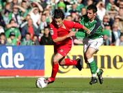 8 October 2005; Simon Davies, Wales, in action against Tony Capaldi, Northern Ireland. FIFA 2006 World Cup Qualifier, Northern Ireland v Wales, Windsor Park, Belfast. Picture credit: Oliver McVeigh / SPORTSFILE