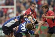 9 October 2005; Alan Quinlan, Munster, is tackled by Reggie Corrigan, left, and Brian O'Riordan, 20, Leinster. Celtic League 2005-2006, Group A, Munster v Leinster, Musgrave Park, Cork. Picture credit: Pat Murphy / SPORTSFILE