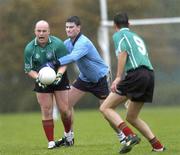 11 October 2005; Peadar Heffron, PSNI, in action against John Manley, UCD. Challenge Match, UCD v PSNI, Belfield Park, UCD, Dublin. Picture credit: Brian Lawless / SPORTSFILE