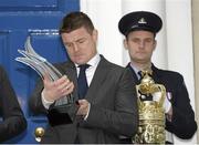 22 March 2014; Former Ireland Rugby International Brian O'Driscoll looks at the trophy after he was awarded the Freedom of the City of Dublin. Mansion House, Dublin. Picture credit: Matt Browne / SPORTSFILE