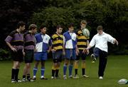 12 October 2005; Ireland's rugby captain Brian O'Driscoll togged out to launch the Gillette M3Power Coaching Clinic. Over 350 schools, clubs and colleges from all over the country will be invited to enter a competition to win a coveted place in this unique Coaching Clinic to celebrate the launch of the Gillette M3Power Nitro razor. Participants in the competition will win the chance to meet and train with the Lions and Irish Captain who will give them tips on handling, kicking and tackling along with devising a range of technical skills and fitness routines to bring them to the top of their game. Pictured getting some kicking tips from Brian are, from left, Morgan Buckley, Karl MacNally, from St Paul's School, Raheny, James Murray, St Andrew's School, Booterstown, Rob Moore, King's Hospital, Alex Murphy, St Andrew's School, Booterstown, and Patrick Davis, King's Hospital. St. Stephen's Green, Dublin. Picture credit: Brendan Moran / SPORTSFILE