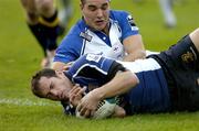 22 October 2005; Felipe Contepomi, Leinster, goes over for a try against Bath despite the tackle of Ollie Barkley. Heineken Cup 2005-2006, Pool 5, Round 1, Leinster v Bath. RDS, Ballsbridge, Dublin. Picture credit: Matt Browne / SPORTSFILE