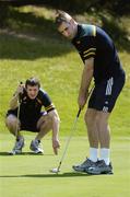 25 October 2005; Ciaran McManus keeps an eye on Mattie Forde putting during a round of golf at the Portsea Golf Club, Sorrento, Mornington Peninsula, Melbourne, Victoria, Australia. Picture credit; Ray McManus / SPORTSFILE