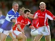 13 November 2005; Peter Russell and Alan Kitson, Monaleen, in action against Denis Russell, St. Senans Kilkee. Munster Club Senior Football Championship, Monaleen v St. Senans Kilkee, Gaelic Grounds, Limerick. Picture credit: Kieran Clancy / SPORTSFILE