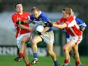 13 November 2005;Michael O'Shea, St. Senans Kilkee, in action against Peter Russell and Barry Fitzpatrick, Monaleen. Munster Club Senior Football Championship, Monaleen v St. Senans Kilkee, Gaelic Grounds, Limerick. Picture credit: Kieran Clancy / SPORTSFILE