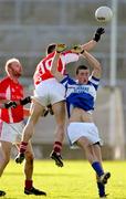 13 November 2005; Kevin Larkin, St. Senans Kilkee, in action against Michael Crowley and Alan Kitson, Monaleen. Munster Club Senior Football Championship, Monaleen v St. Senans Kilkee, Gaelic Grounds, Limerick. Picture credit: Kieran Clancy / SPORTSFILE