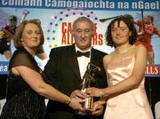 12 November 2005; Claire Grogan, from Tipperary, who was presented with her award by Ossie Kilkenny, Chairperson, of the Irish Sports Council and Miriam O'Callaghan, left, President, Cumann Camogaiochta na nGael, at the 2005 Camogie All-Star Awards, in association with O'Neills. Citywest Hotel, Dublin. Picture credit: Brendan Moran / SPORTSFILE