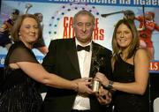 12 November 2005; Gemma O'Connor, from Cork, who was presented with her award by Ossie Kilkenny, Chairperson, of the Irish Sports Council and Miriam O'Callaghan, left, President, Cumann Camogaiochta na nGael, at the 2005 Camogie All-Star Awards, in association with O'Neills. Citywest Hotel, Dublin. Picture credit: Brendan Moran / SPORTSFILE