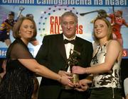 12 November 2005; Eimear McDonnell, from Tipperary, who was presented with her award by Ossie Kilkenny, Chairperson, of the Irish Sports Council and Miriam O'Callaghan, left, President, Cumann Camogaiochta na nGael, at the 2005 Camogie All-Star Awards, in association with O'Neills. Citywest Hotel, Dublin. Picture credit: Brendan Moran / SPORTSFILE